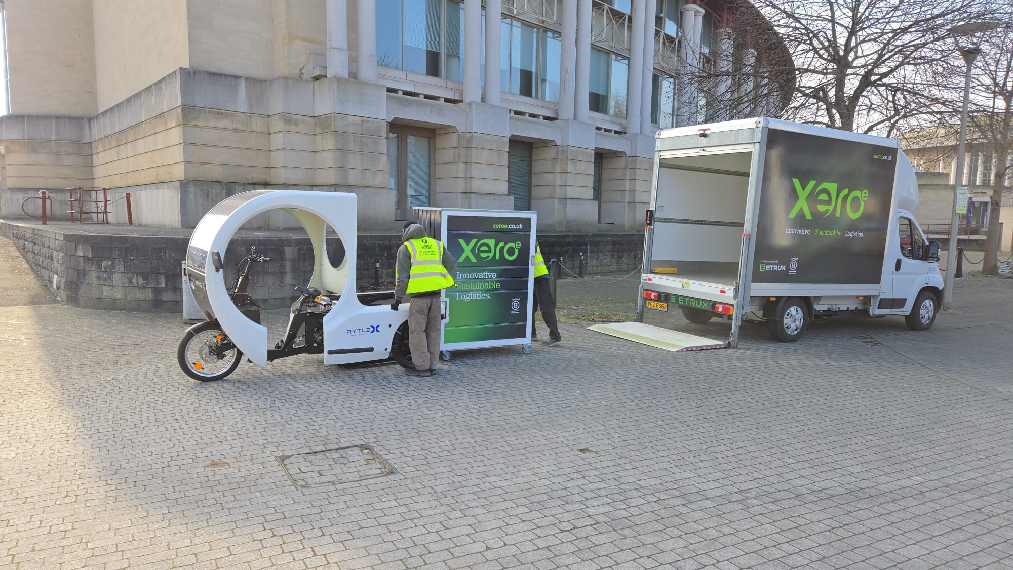 XeroE cargo bike and electric van at a virtual hub transfer point